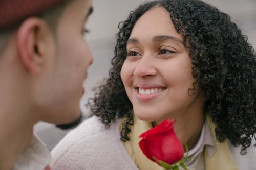 Hispanic couple with red rose