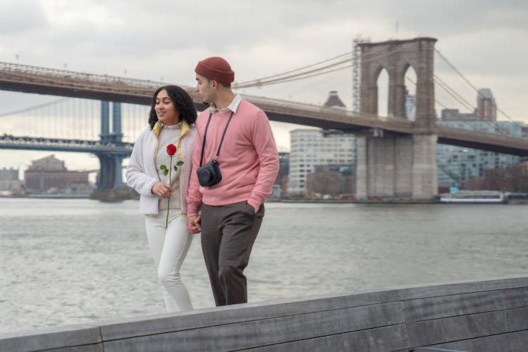 Hispanic Couple Walking Near Sea