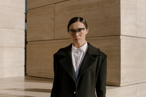 Woman with Eyeglasses Wearing a Black Coat