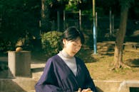 Woman Wearing a Cover Up Over her Turtleneck Top