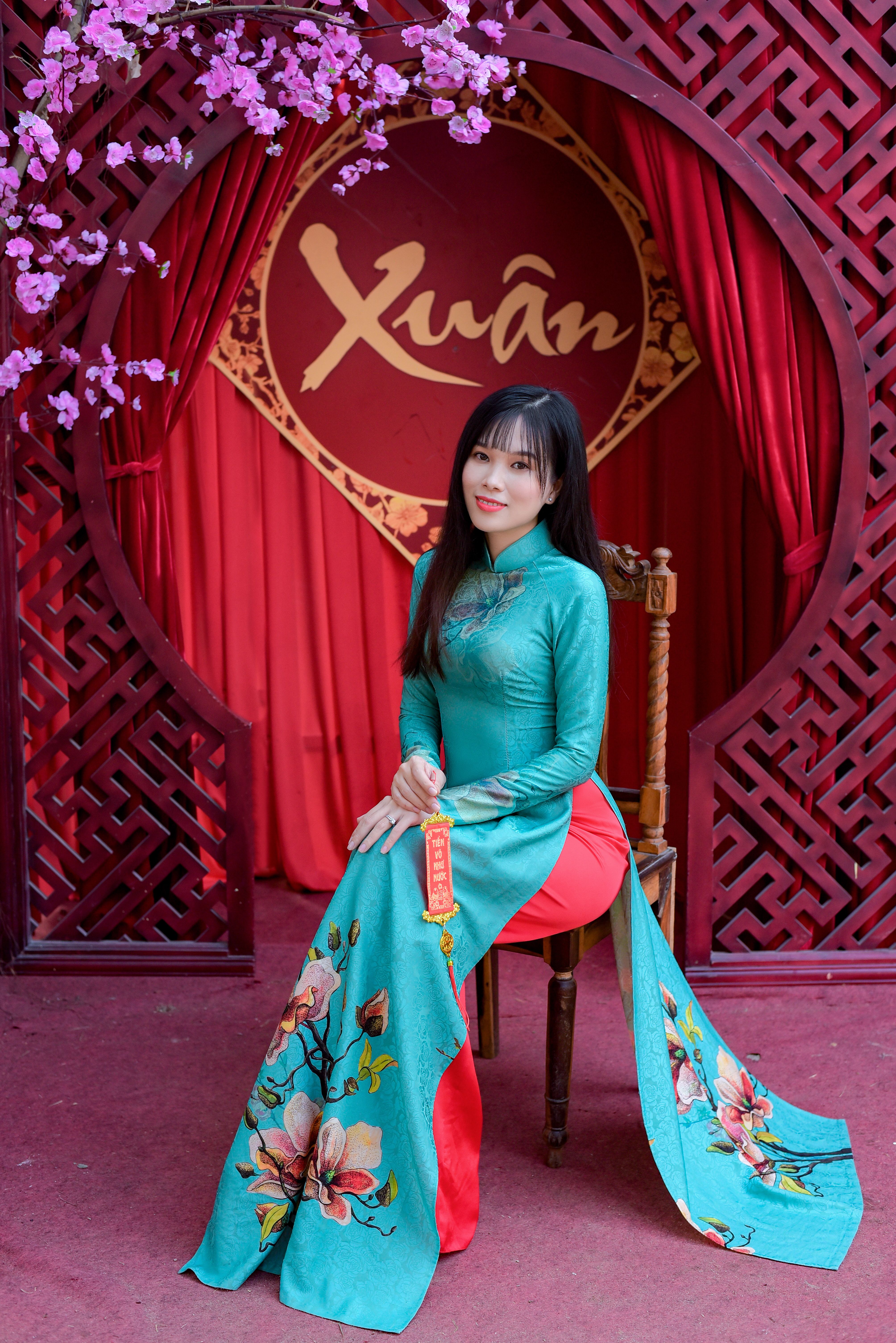 Woman Wearing Traditional Dress Sitting on a Chair · Free Stock Photo