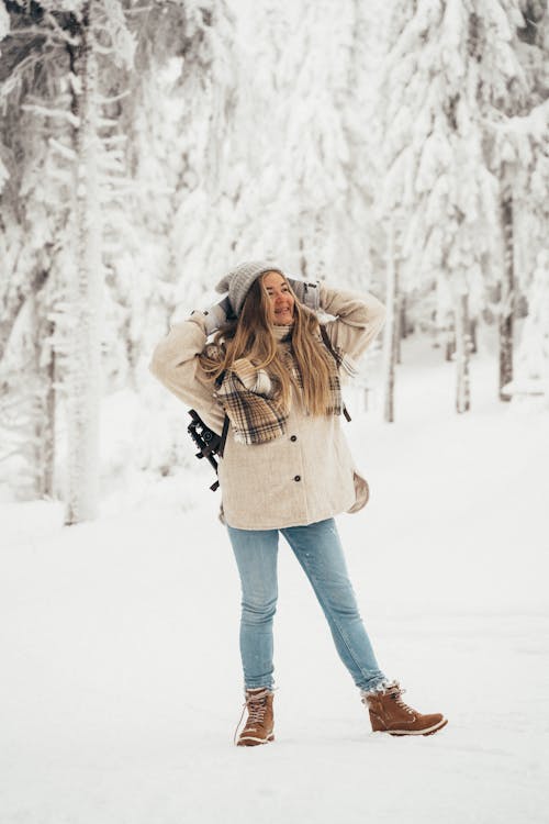 Free Woman Standing on Snow Covered Ground Stock Photo