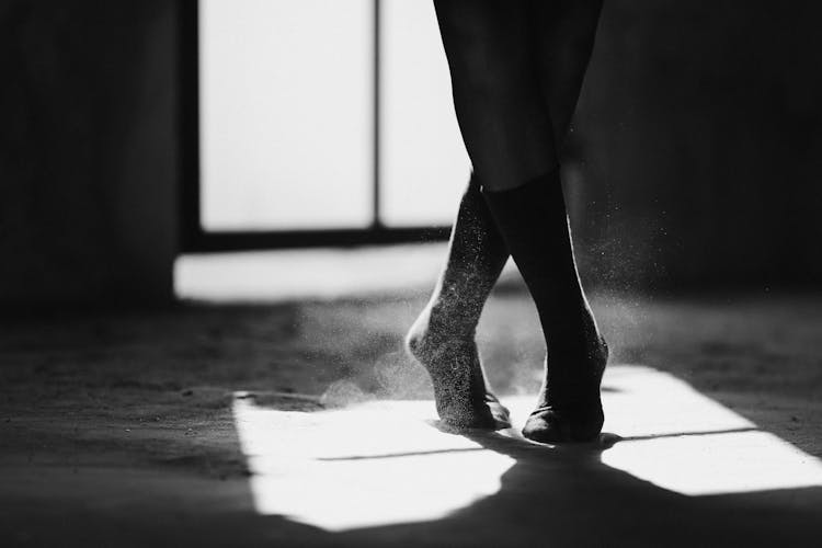 Crop Ballerina Silhouette Dancing On Floor With Shadow