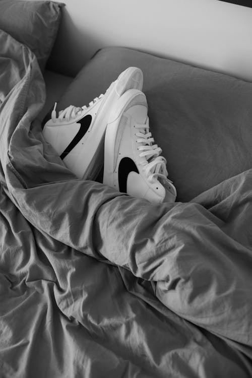 Free White Shoes on the Bed  Stock Photo