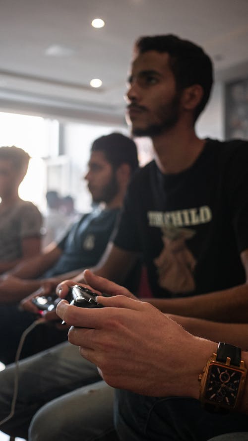 Man in Black Shirt Holding Black Game Controller