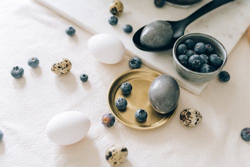 Free Assorted Kinds of Eggs and Blueberries on a White Table Stock Photo