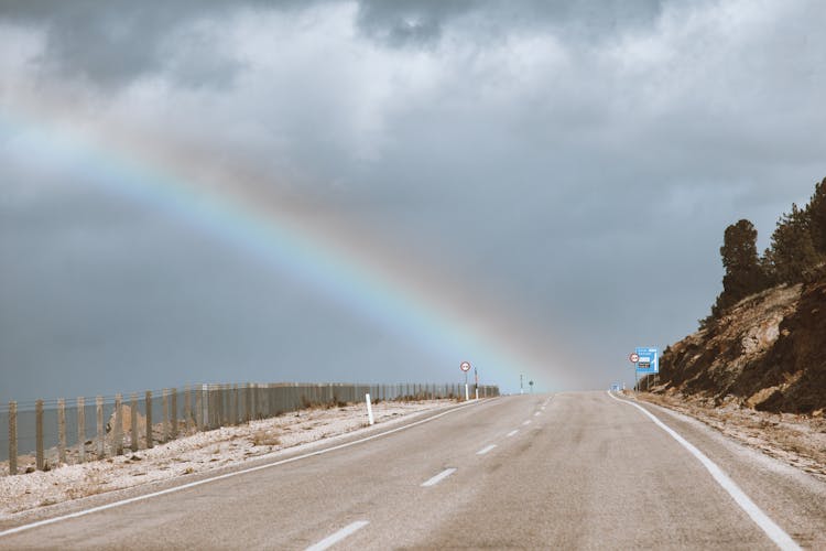 Rainbow In The Sky And A Road