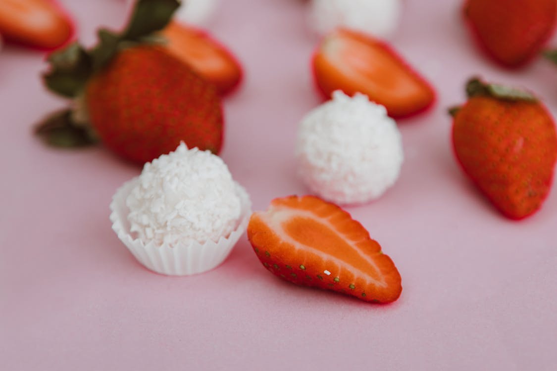 Coconut Truffle Beside Red Strawberries