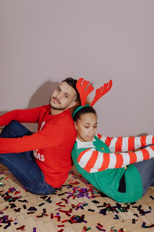 Free A Couple Sitting on the Floor Stock Photo