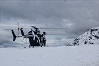 A Helicopter on a Snow Covered Ground