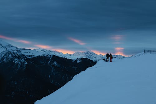 People in Mountains during Overcast