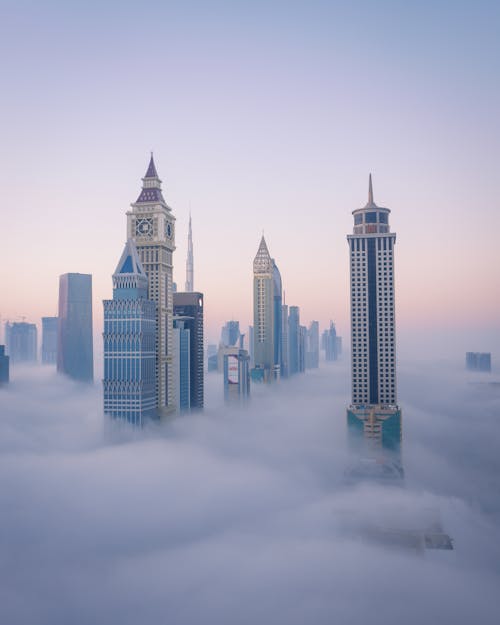 Foto stok gratis awan, cityscape, di atas awan