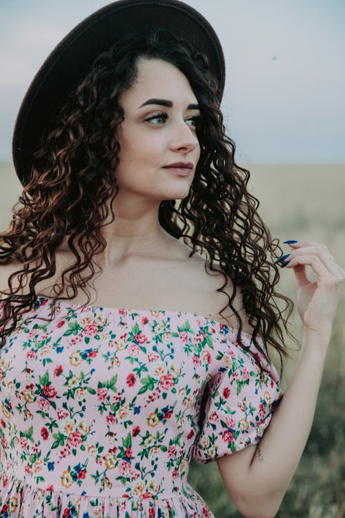 Woman Wearing a Hat Looking Afar