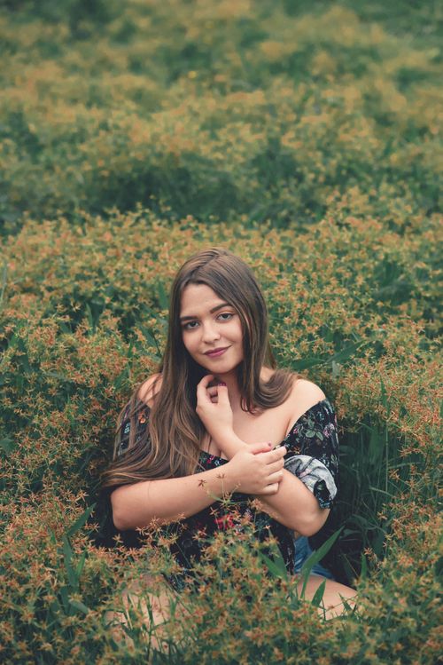 White dress in a wildflower meadow, casual spring style