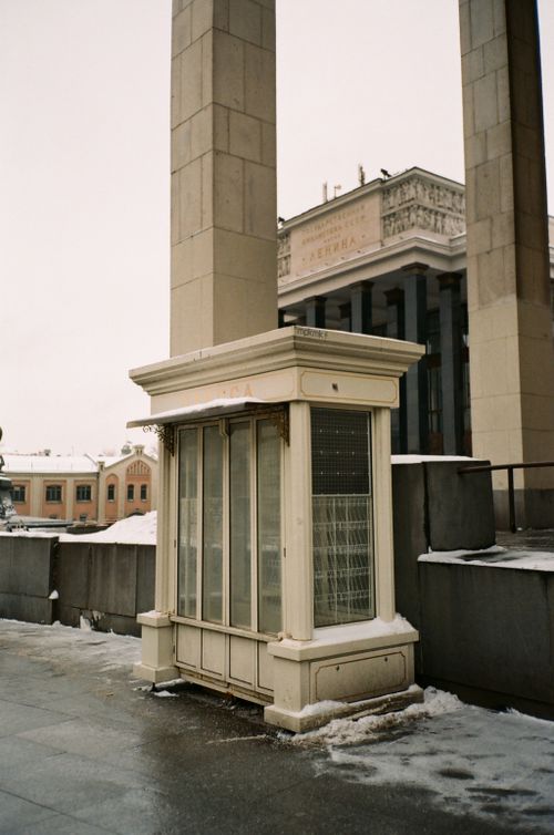 Free Small concrete construction on pass way outside contemporary building in winter city on cloudy day Stock Photo