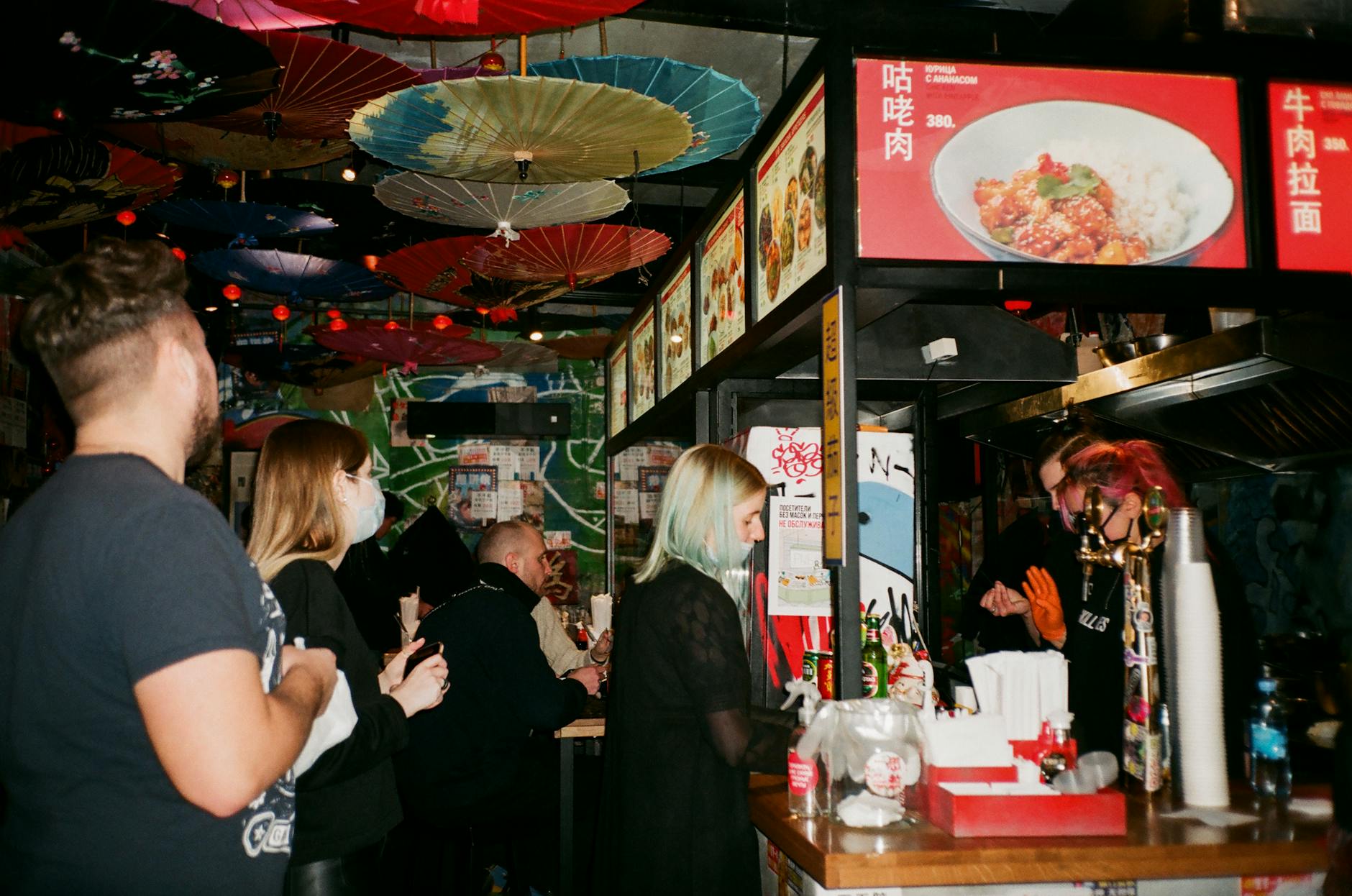 Queue waiting for Asian food counter in restaurant