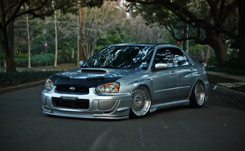 Silver Car Parked on the Road