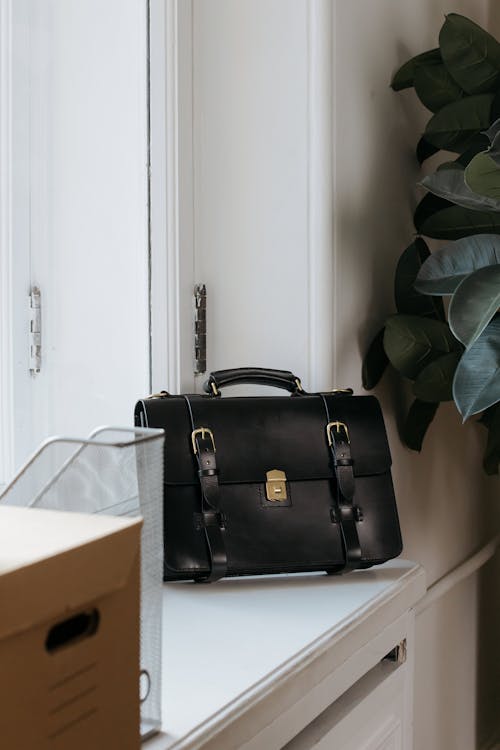 Black Leather Handbag on the Table