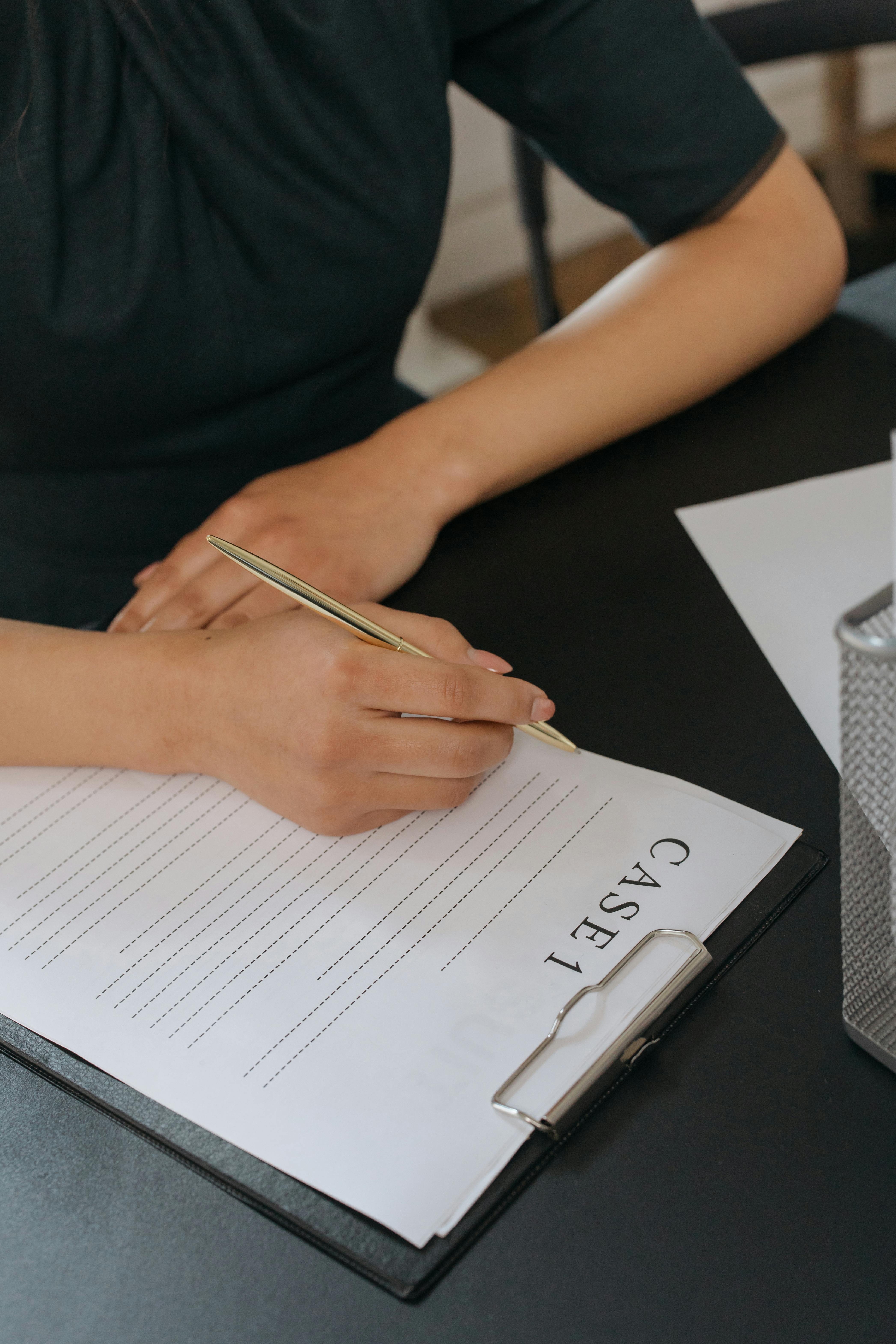 a person holding a pen