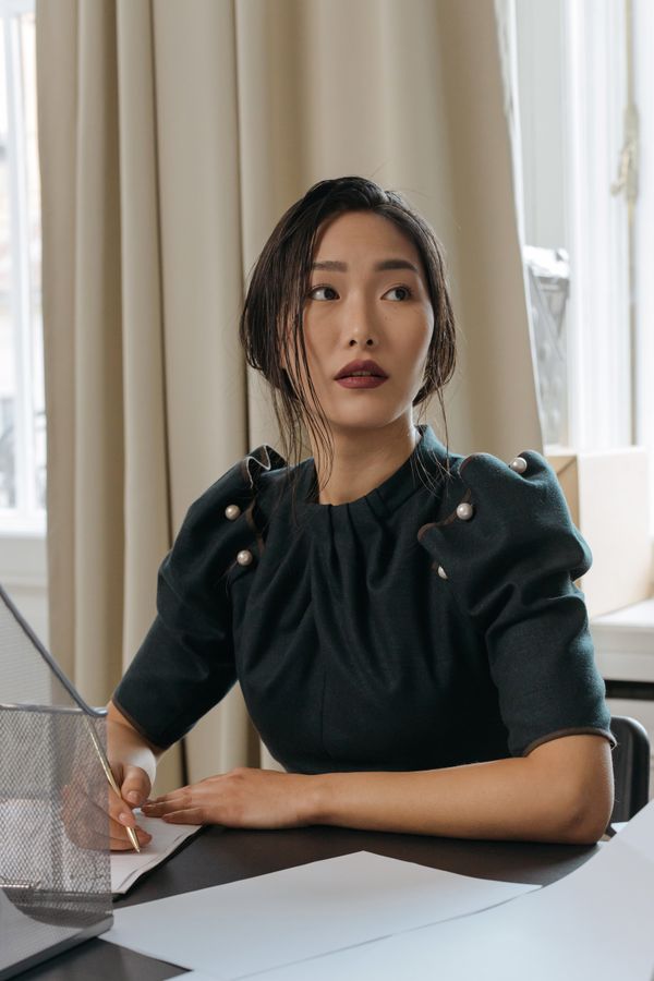 Woman in peplum top office professional outfit
