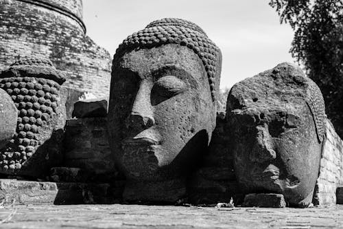 Grayscale Photo of a Stone Carvings