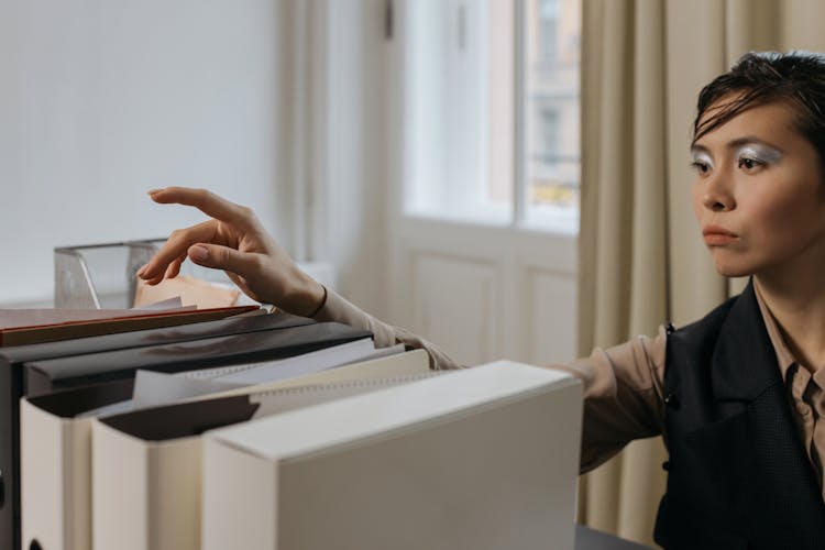 A Woman Looking At The Documents