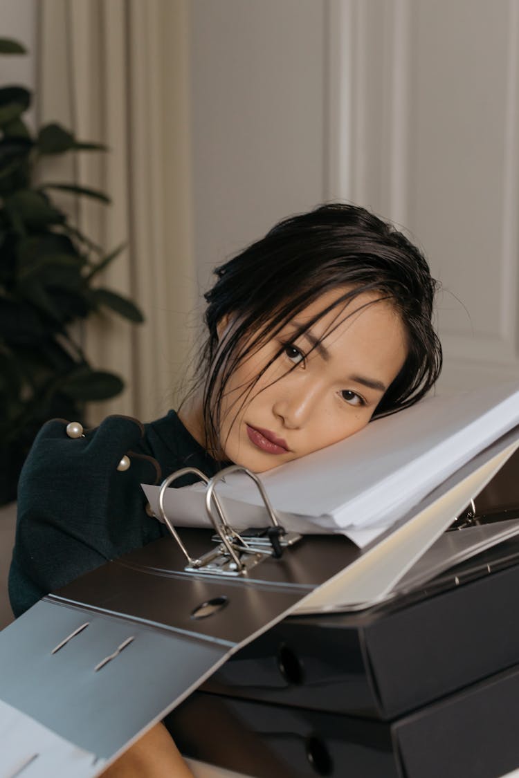 Woman Leaning On The Documents