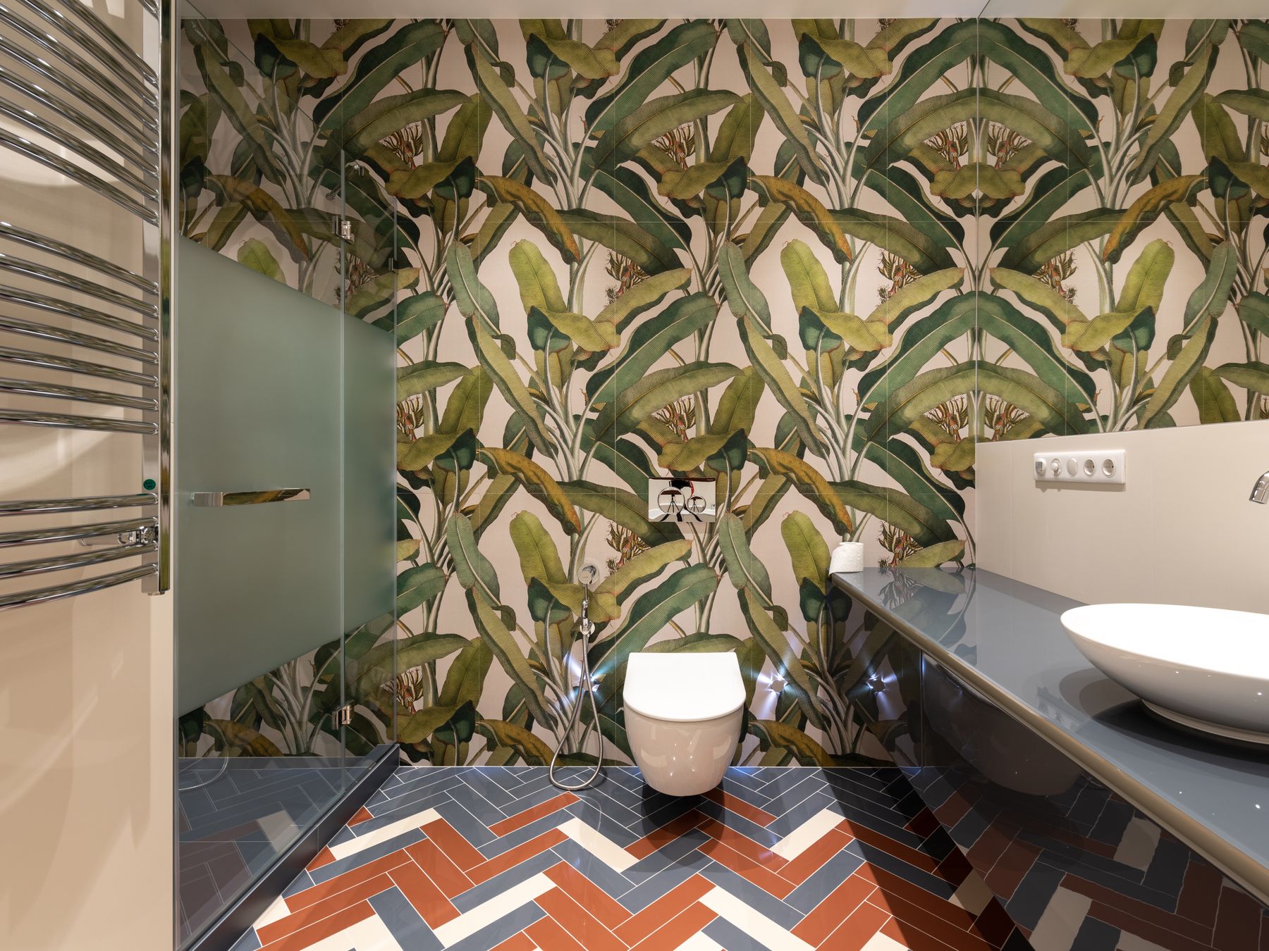 Wallpapering in Tufnell Park — careful masking before painting begins