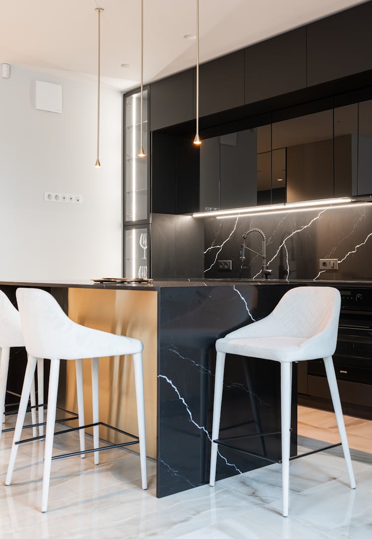 Kitchen Interior With Black Marble Island Counter