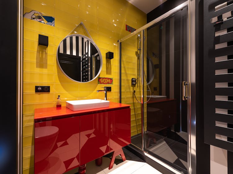 Colorful Bathroom With Sink On Cabinet Near Mirror And Shower