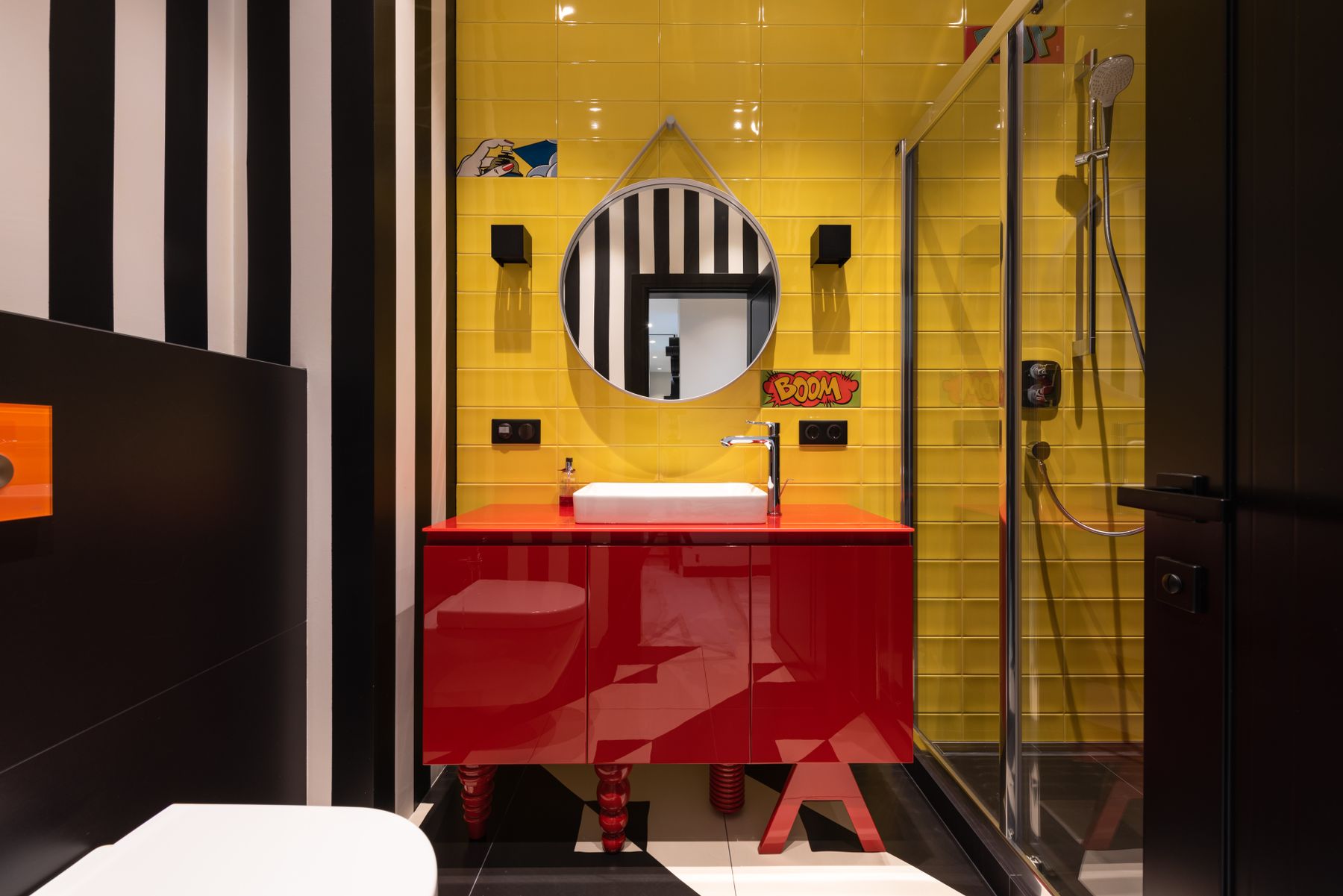 Colorful bathroom with yellow walls, red vanity and modern fixtures