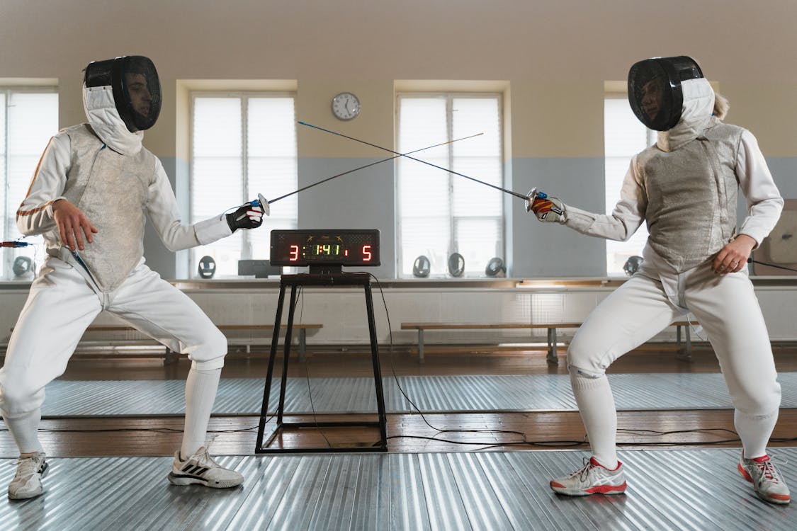 Free Fencers in their Fighting Stance Stock Photo