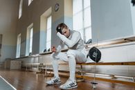 A Fencer Sitting on the Bench
