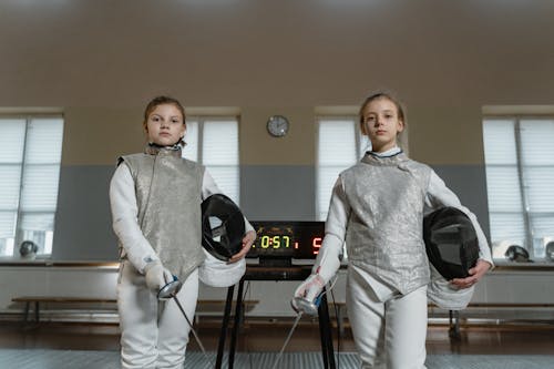 Girls in a Fencing Match
