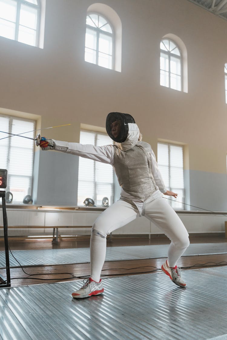 A Fencer Engaged In A Match