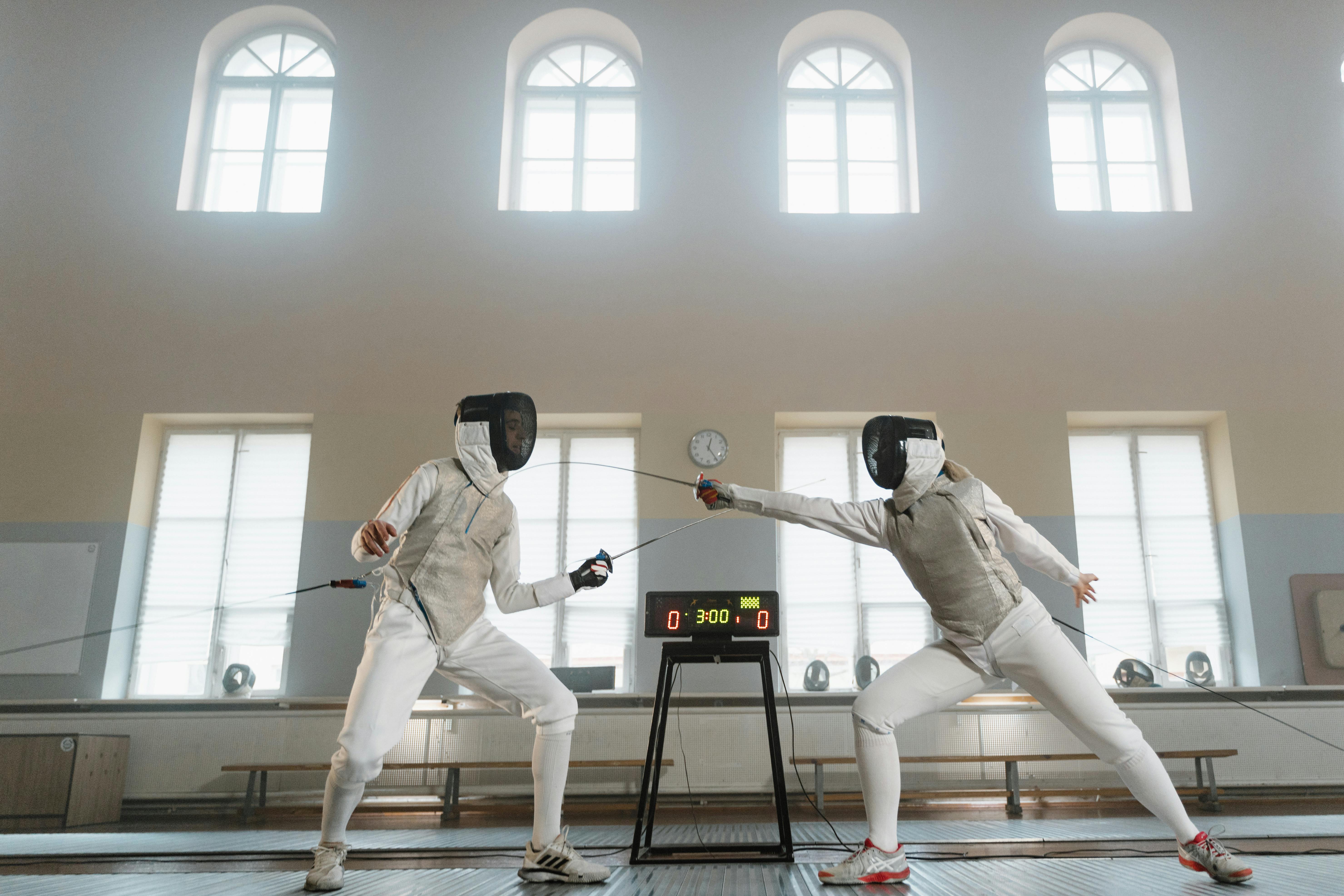 fencers in a competitive match