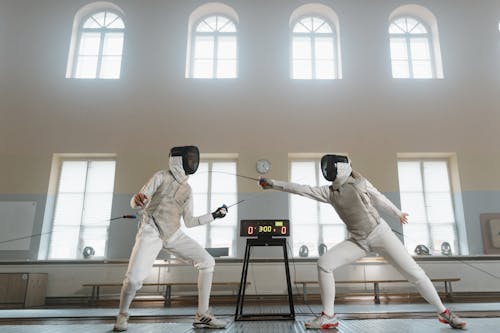 Free Fencers in a Competitive Match Stock Photo