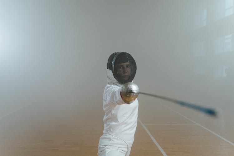 A Female Fencer In Her Fighting Stance