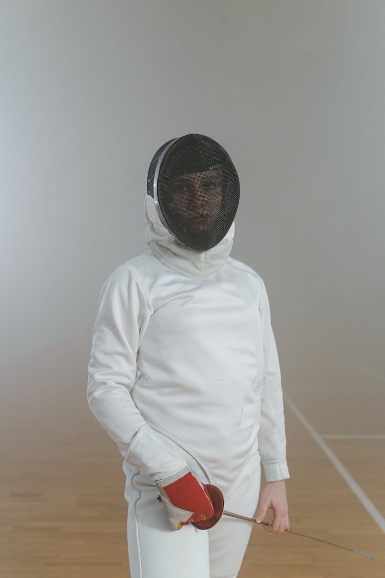 A Woman In Her Fencing Uniform