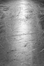 A Dirty Gray Floor with Multiple  Scratches