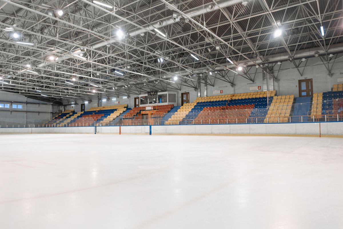Empty Ottermere Ice Arena with bright lights over a clear sheet