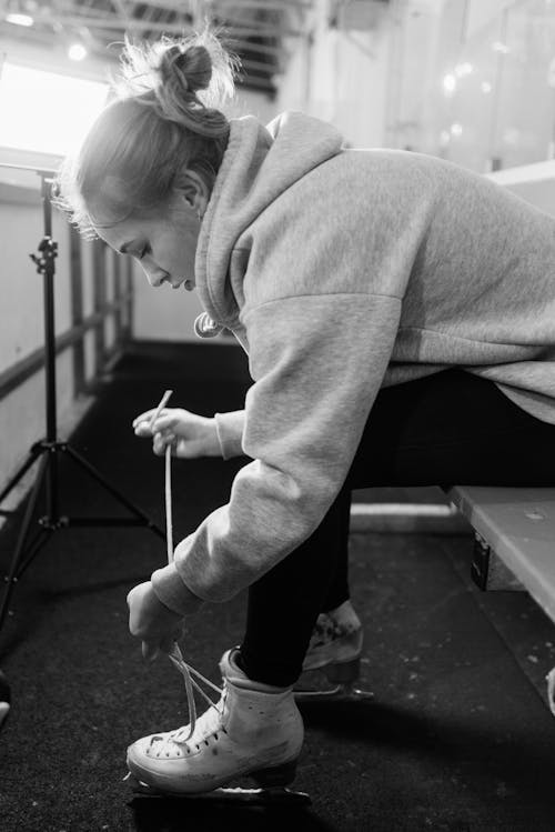 Woman Putting on her Ice Skates