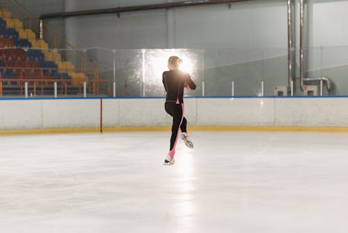 A Person Ice Skating at the Ice Rink