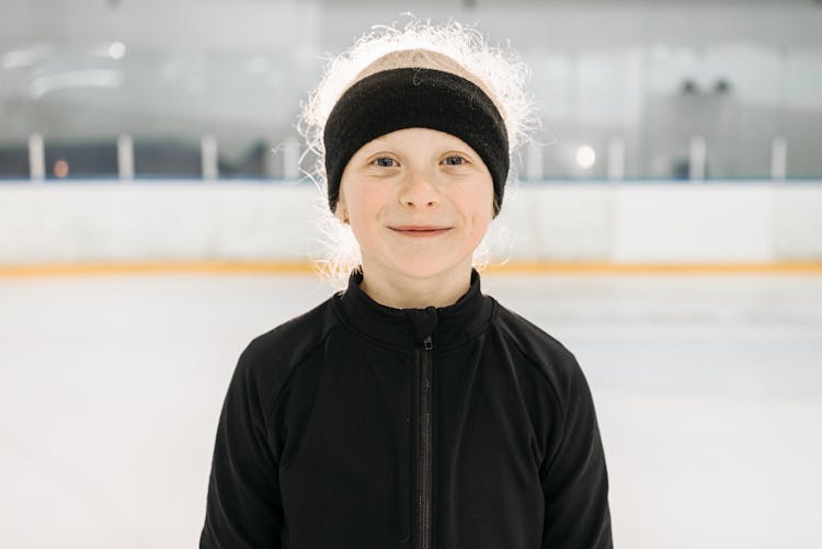 A Pretty Girl In Black Jacket With Black Sports Headband