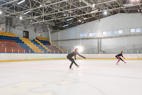 Young Women Practicing Figure Skating 