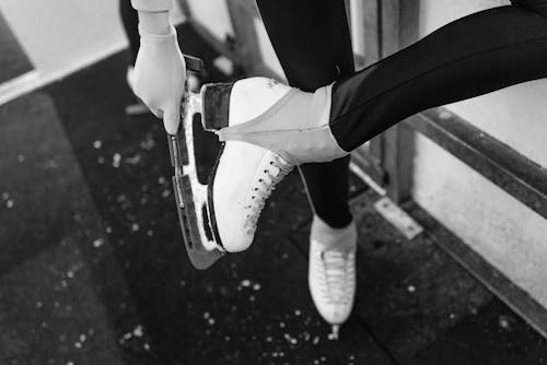 Monochrome Shot of a Person Wearing Ice Skating Shoes