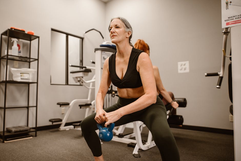 person performing a squat with weights - is it ok to do full body workouts everyday person performing a squat with weights - is it ok to do full body workouts everyday