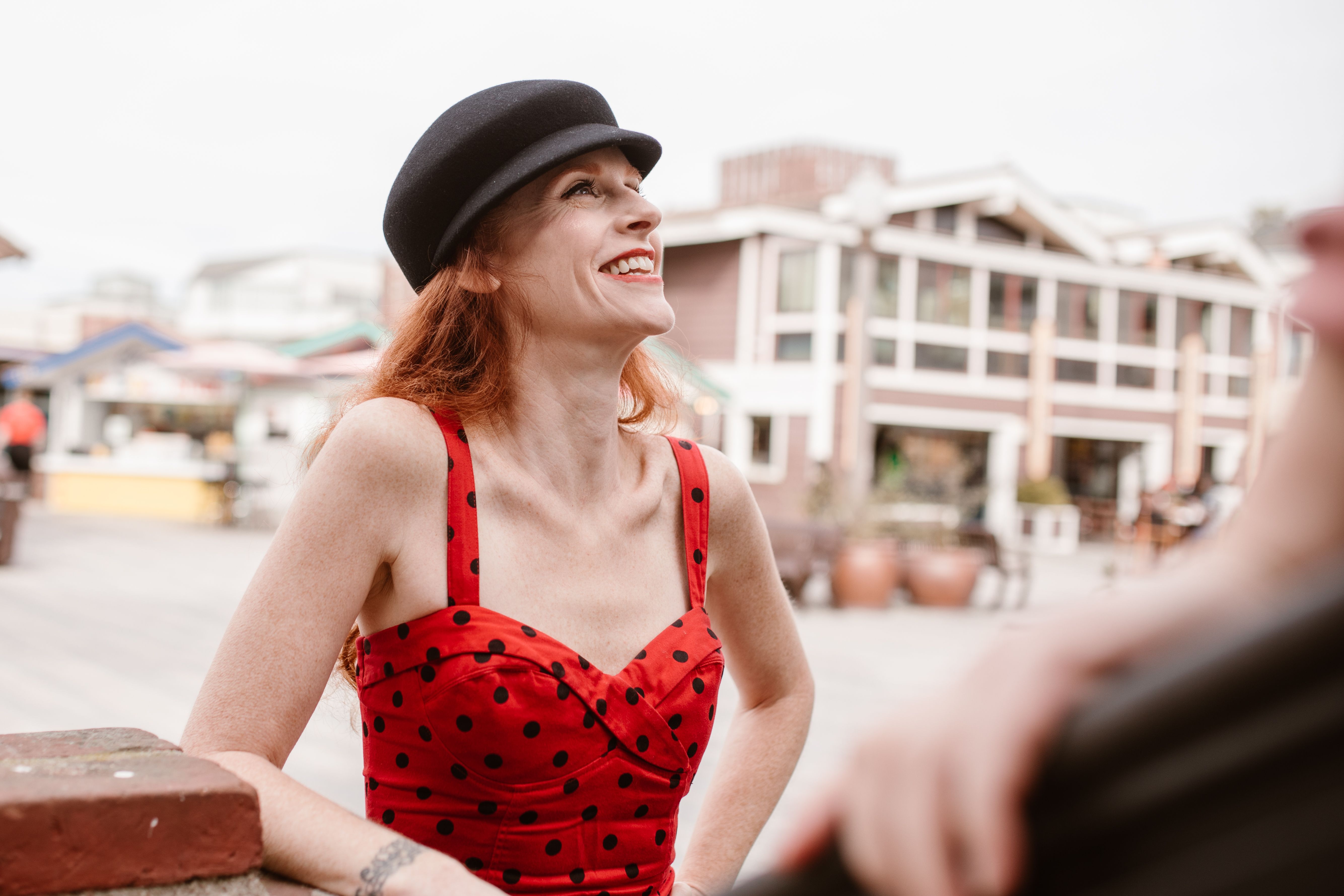 A Woman in Red Polka Dot Dress Smiling · Free Stock Photo