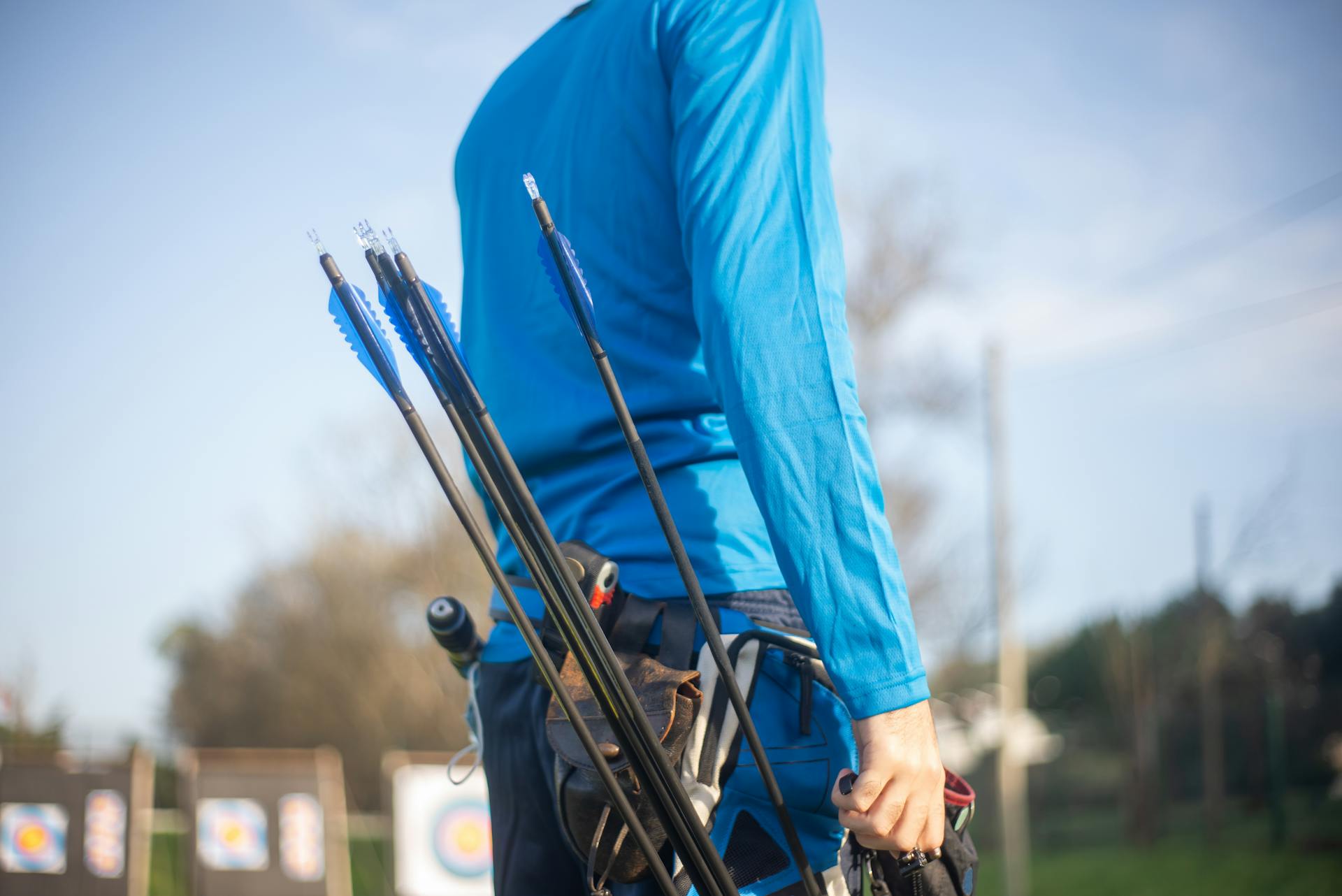 Close-up Photo of Blue Archery Arrows