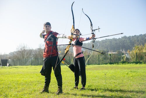 Archers aiming at an Archery Target 